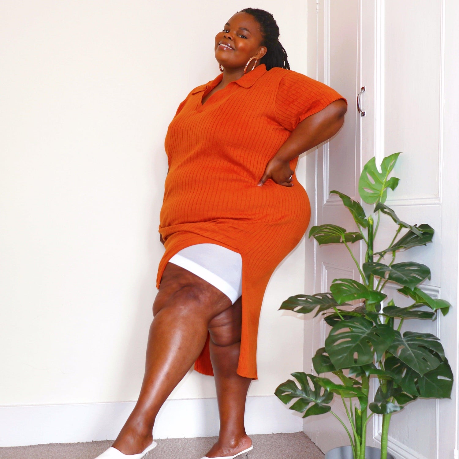 Woman wearing white chub rub shorts
